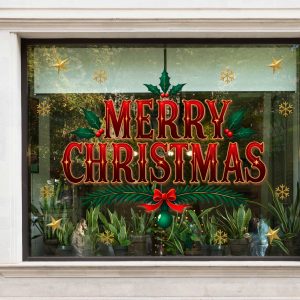 Bold Merry Christmas Window Decals with Holly Leaves Red Bow Snowflakes and Gold Stars Vinyl Stickers for Festive Storefront Decor